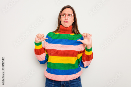 Young caucasian cute woman isolated on white background showing thumb down  disappointment concept.