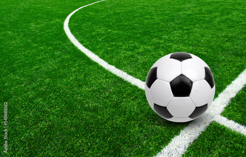 Soccer ball on stadium field texture