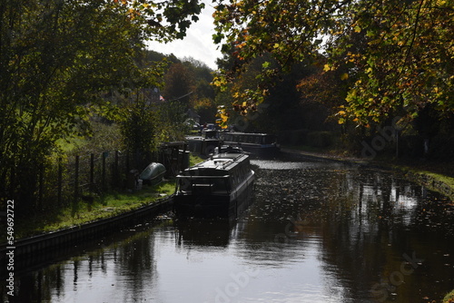 canal boats docked on the side of the canal at the Stewponey in Stourton photo