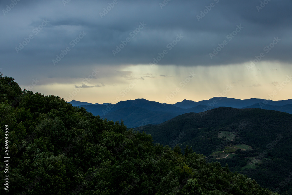 Sunset and dramatic clouds in La Garrotxa, Spain