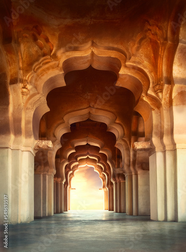 Arch of Lotus Mahal Temple in Hampi  Karnataka  India. Unesco world heritage site.beautifully carved stone arch and sunset