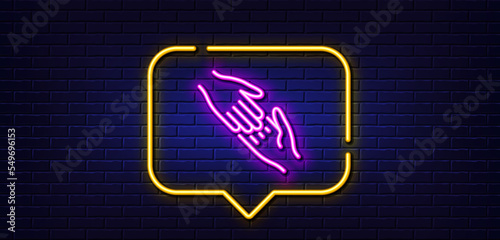 Neon light speech bubble. Helping hand line icon. Give gesture sign. Charity palm symbol. Neon light background. Helping hand glow line. Brick wall banner. Vector