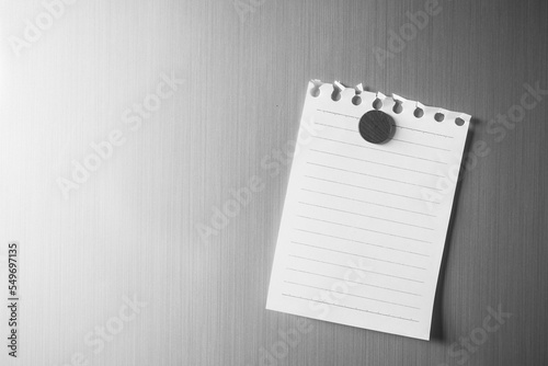 Empty paper sheet on refrigerator door. Note paper with magnetic. Valentine send text love message. Memory day note story everyday. photo