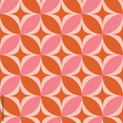 Mid century modern atomic starbursts on orange and pink circles seamless pattern. For home décor, wallpaper and textile 