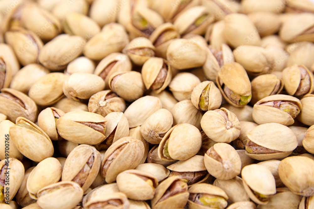 Pistachios as food background. Pistachio nuts, soft focus