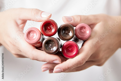 Pigments in bottles for tattoos and permanent makeup in woman hands. Tattoo ink photo