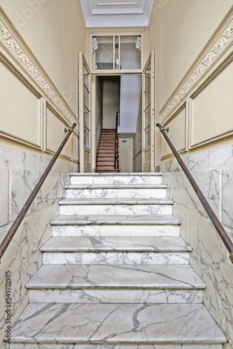 Marble stairs in renovated mansion stairwell © pbombaert