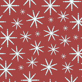 Seamless pattern with large and small snowflakes on a red background. Vector