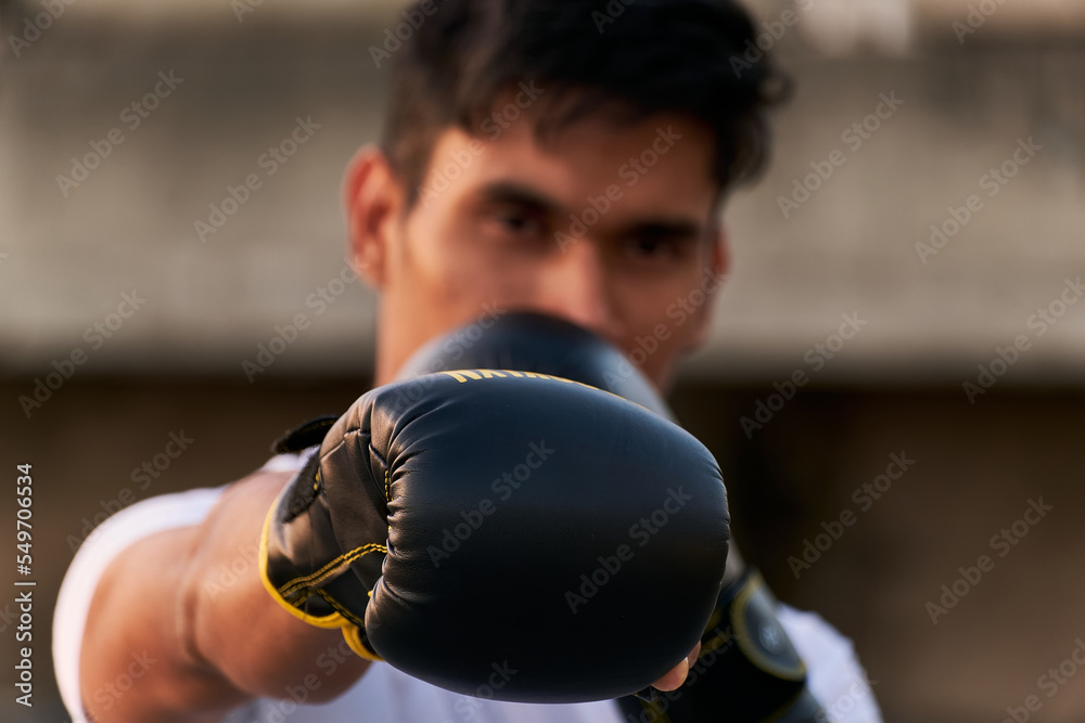Sportsman boxer hitting frontally
