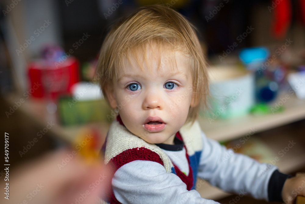 Cute blond baby with blue eyes. High quality photo Cute blond baby with blue eyes. High quality photo