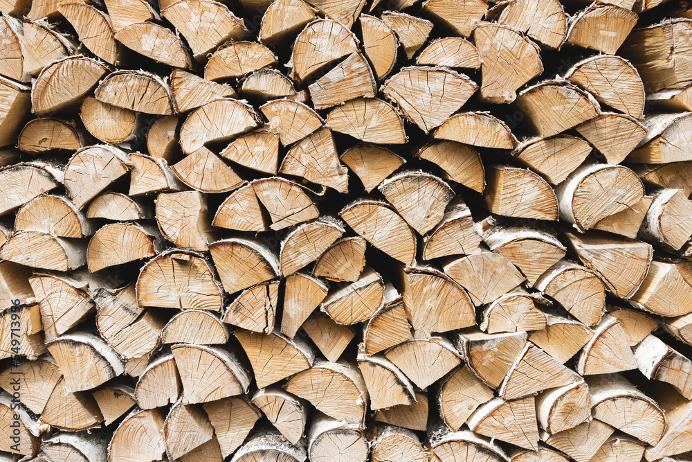 Firewood background. Dry chopped wooden logs. Natural texture. Firewood background. Dry chopped wooden logs. Natural texture.