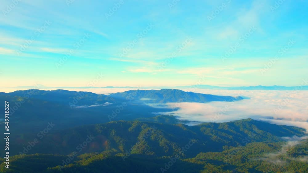Aerial view over dense fog and beautiful mountains during sunrise. landscape of tropical rainforest in winter. Pai District, Mae Hong Son Province, Northern Thailand. travel and nature concept. 4K
Aerial view over dense fog and beautiful mountains during sunrise. landscape of tropical rainforest in winter. Pai District, Mae Hong Son Province, Northern Thailand. travel and nature concept. 4K