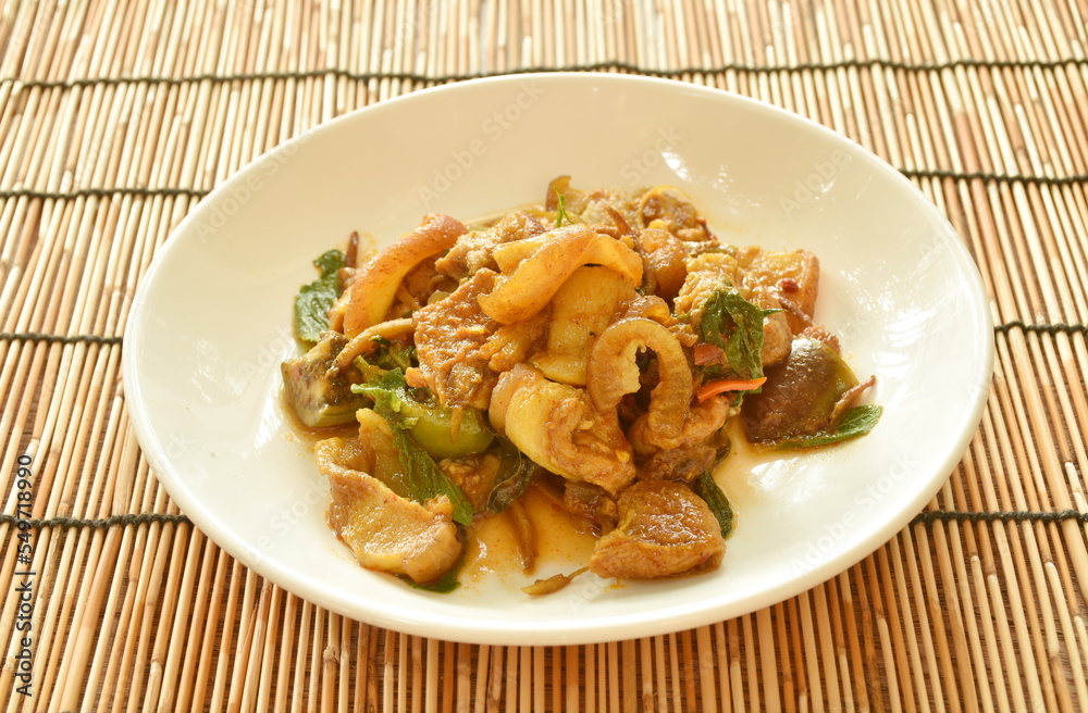 stir fried spicy wild boar and eggplant with red curry on plate stir fried spicy wild boar and eggplant with red curry on plate