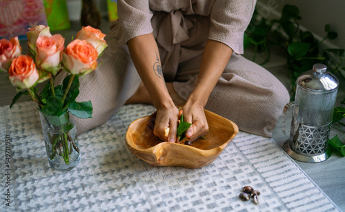 Young woman intentionally making flower infused herbal bath