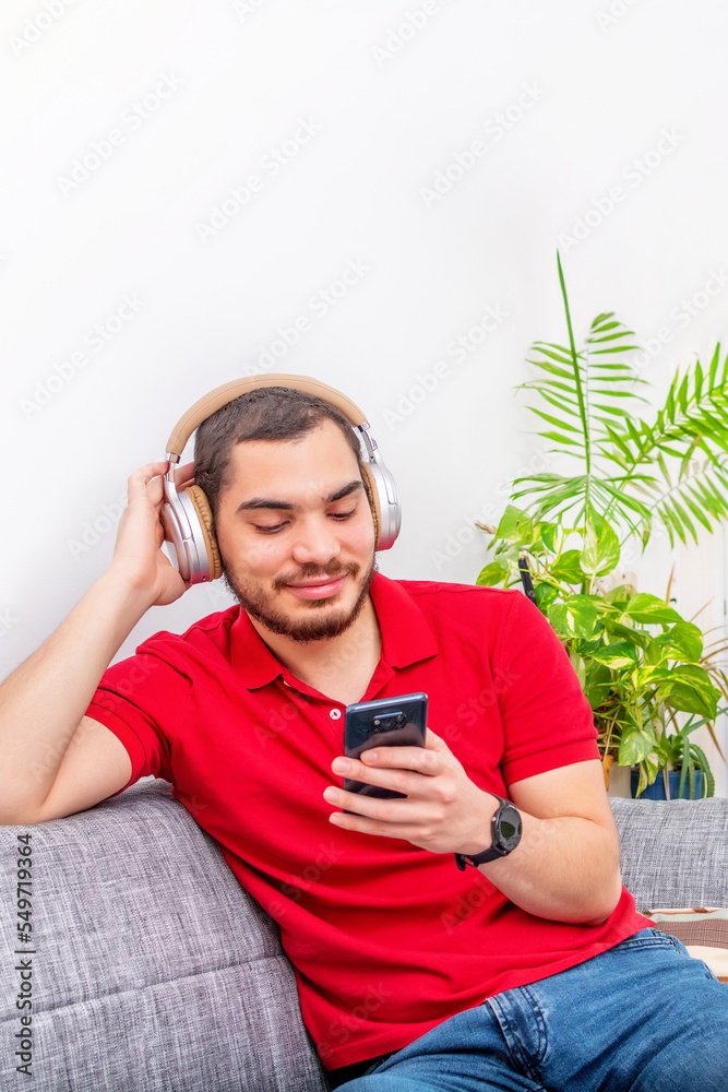 Fototapeta premium Man smile listening music at home.