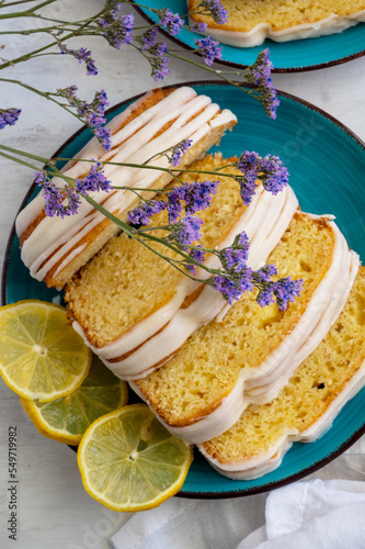 Lemon fruit cake on plate with lemon slices. Delicious breakfast or tea time. Lemon cake. 