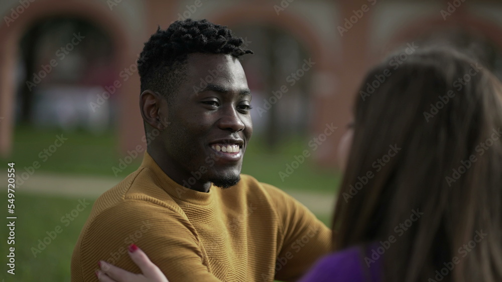 Friendly happy black African man on a date with girl