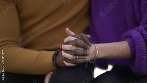 Diverse hands together. Close-up black man and white woman holding hand together