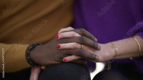 Close-up diversity hands together. Two people hand in hand