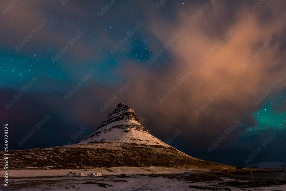 Northern lights in Iceland with distinctly shaped mountain on foreground