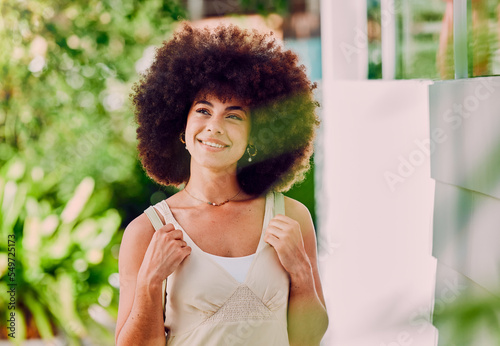 Black woman, travel and happy while walking in a city, smile and relax, having fun and thinking outdoors. Student, girl and backpack for traveling in Mexico, explore, sightseeing and solo adventure