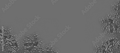 black and white Julia fractal with trapped air bubbles on a plan grey background
