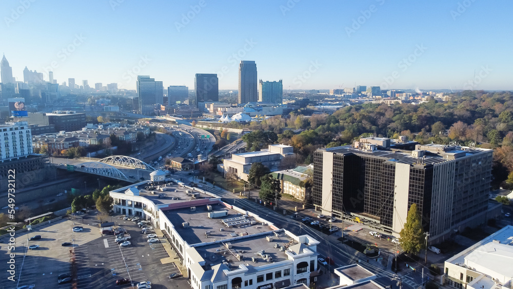 Fototapeta premium Office buildings and high-rise cooperate towers in background along Peachtree bridge street midtown Atlanta busy I-75 and I-85 split, Georgia