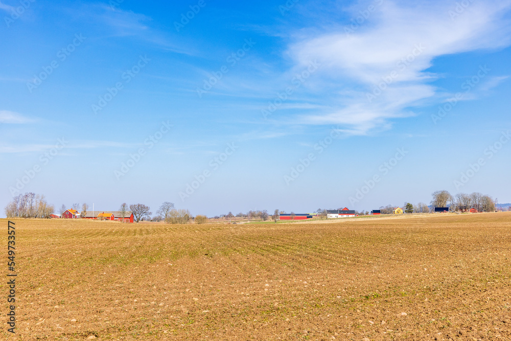 Cultivated land with farms in the countryside Cultivated land with farms in the countryside