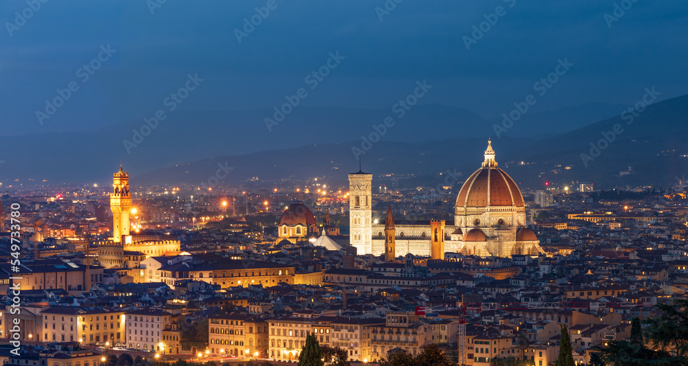 A panoramic view of the roofs and domes of the cathedrals of evening Florence from the upper viewing platform