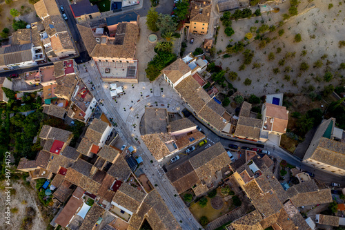 Aerial view, municipality of Calvia with the Església Sant Joan Baptista church, on the edge of the Tramuntana mountains, Mallorca, Balearic Islands, Spain