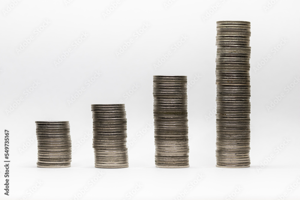 Pile of coins in white background close-up arranged in a row Pile of coins in white background close-up arranged in a row