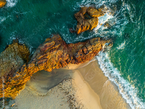 Aerial view of a natural arch along the coast in Jericoacoara, State of Ceara, Brazil. photo