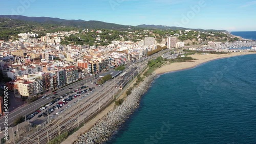 Wallpaper Mural Picturesque drone view of coastal Spanish town of Arenys de Mar on bank of Mediterranean coast overlooking large sandy beach on sunny autumn day, Barcelona Province, Catalonia. High quality 4k footage Torontodigital.ca