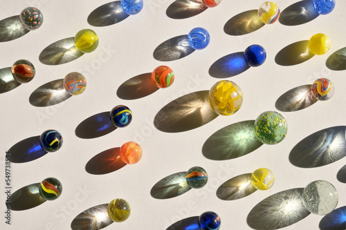 Closeup of a bunch of marbles and shadows