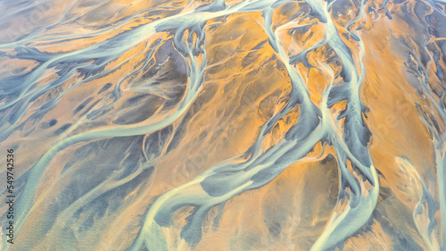Aerial view of abstract water formation near Olfusa river bank in Iceland.