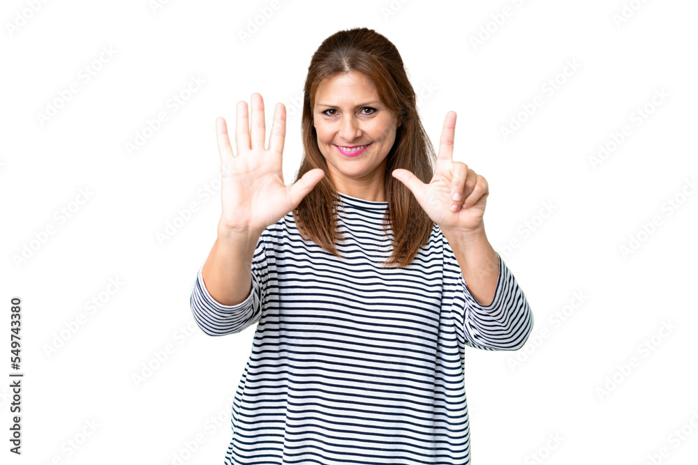 Middle age woman over isolated background counting seven with fingers Middle age woman over isolated background counting seven with fingers