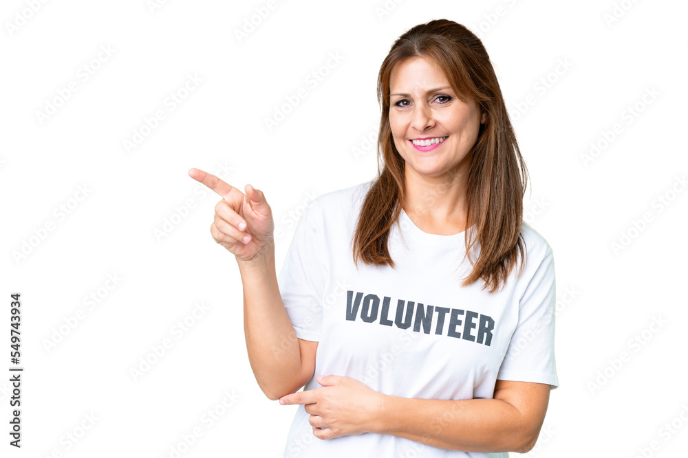 Middle age volunteer woman over isolated background pointing finger to the side Middle age volunteer woman over isolated background pointing finger to the side