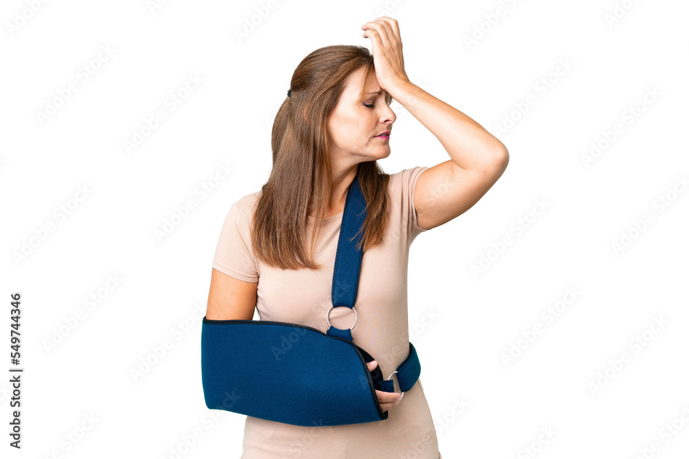 Middle age with broken arm and wearing a sling over isolated background has realized something and intending the solution Middle age with broken arm and wearing a sling over isolated background has realized something and intending the solution