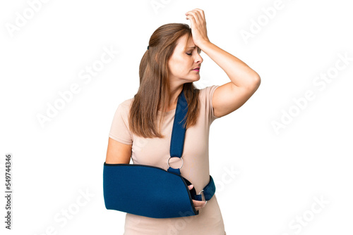 Middle age with broken arm and wearing a sling over isolated background has realized something and intending the solution