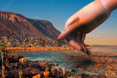 Large mannikin hand reaching down against serene red landscape