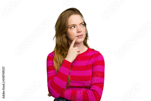 Young caucasian redhead woman isolated looking sideways with doubtful and skeptical expression.