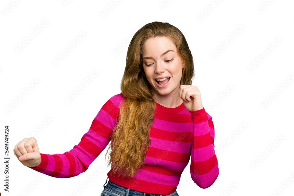 Young caucasian redhead woman isolated dancing and having fun. Young caucasian redhead woman isolated dancing and having fun.