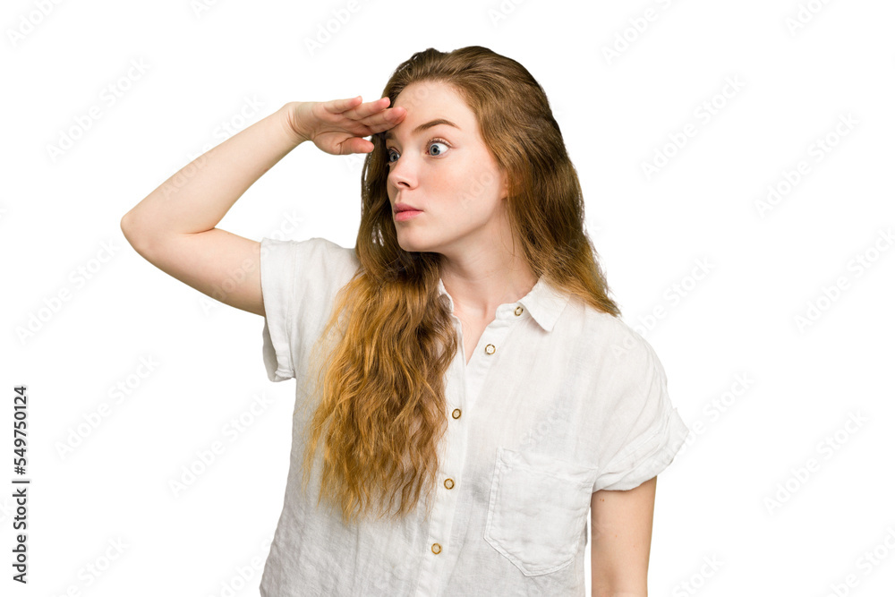 Young caucasian redhead woman isolated looking far away keeping hand on forehead. Young caucasian redhead woman isolated looking far away keeping hand on forehead.