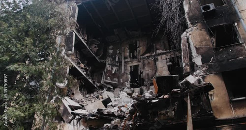Destroyed residential modern house after air attack. Catastrophe. Holes in the walls from shells. Catastrophe