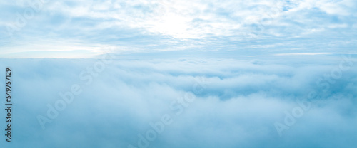 Flying above the stormy clouds. Aerial close up cloud view over Latvia.