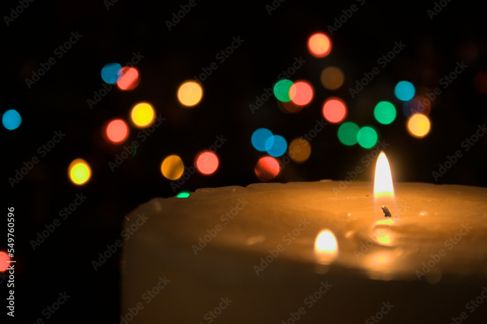 Christmas candle bokeh coloured lights blurred background Christmas candle bokeh coloured lights blurred background