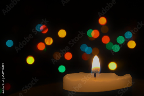 Christmas candle bokeh coloured lights blurred background