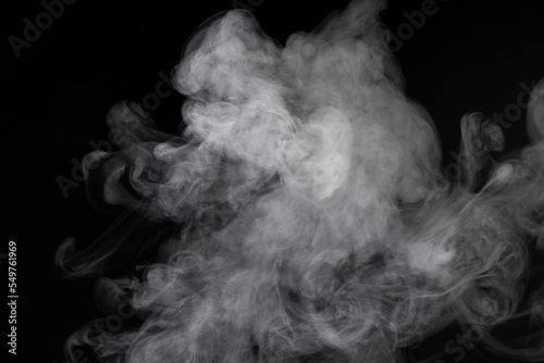 Closeup shot of white smoke on the black background