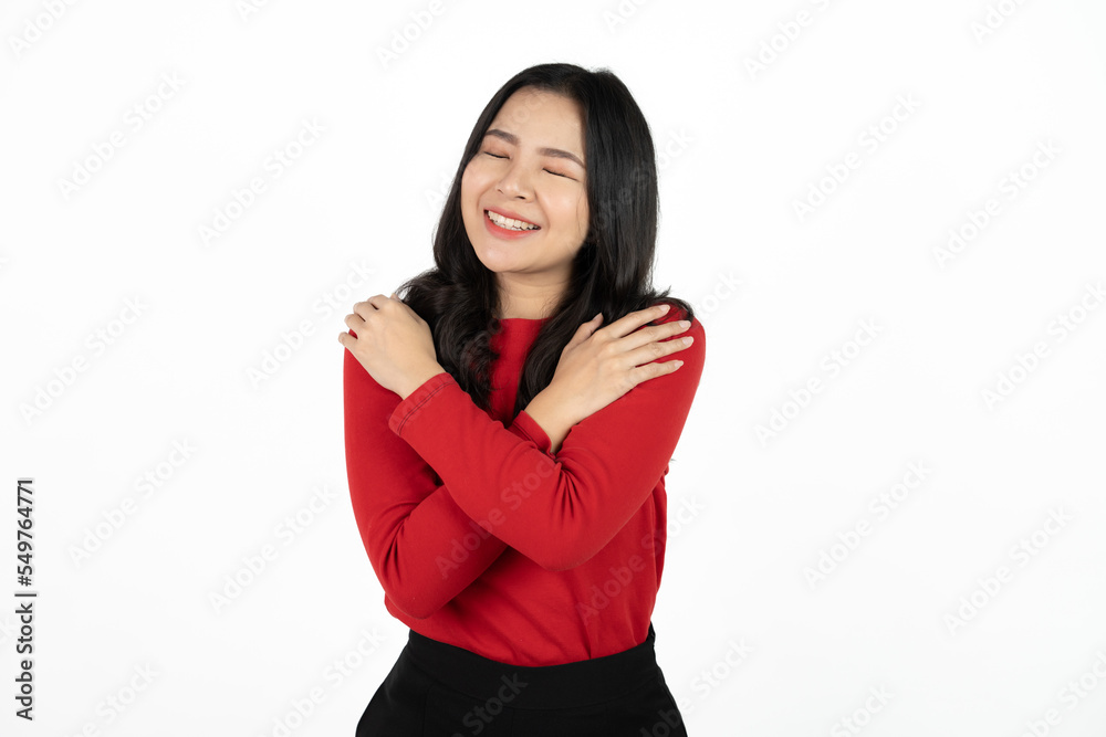 Love yourself. Pretty glad Asian girl embraces herself, feels comfort and care, tilts head isolated over white background. Love yourself. Pretty glad Asian girl embraces herself, feels comfort and care, tilts head isolated over white background.