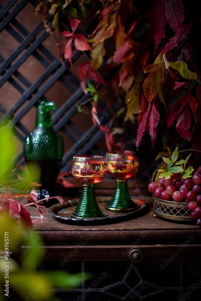 wine in a beautiful green bottle in the form of a bird. grape red wine.